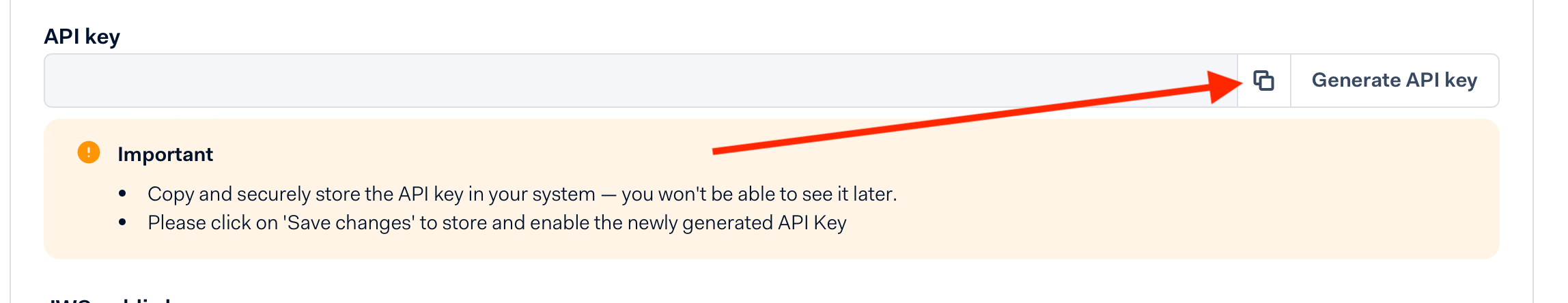 The API key field with an arrow pointing at its copy button, above Adyen's note to store the key now